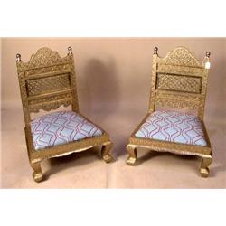AN ELABORATELY DECORATED SUITE OF GERMAN-SILVER MOUNTED LOW TABLE AND TWO SLIPPER CHAIRS