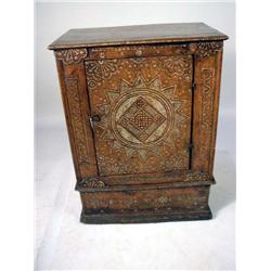 A MOROCCAN STYLE BONE INLAID AND CARVED WALNUT CABINET