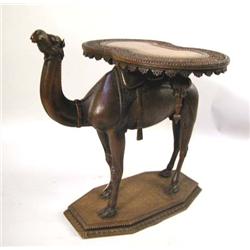 A CARVED HARDWOOD FIGURAL CAMEL SIDE TABLE