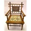 Image 1 : A PART-EBONIZED FAUX BAMBOO ARMCHAIR