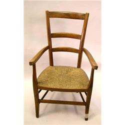 A FRENCH PROVINCIAL STYLE CHERRYWOOD LADDERBACK RUSH SEAT FAUTEUIL