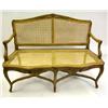 Image 1 : A LOUIS XV CARVED WALNUT CANED SEAT CANAPE