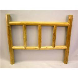 A PINE LOG BEDSTEAD