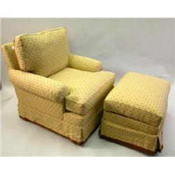 A BEIGE AND RED UPHOLSTERED CLUB CHAIR AND OTTOMAN