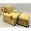 Image 1 : A BEIGE AND RED UPHOLSTERED CLUB CHAIR AND OTTOMAN