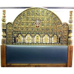 A HEAVILY CARVED AND POLYCHROME-DECORATED BEDSTEAD