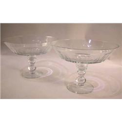 A PAIR OF COLORLESS GLASS THUMBPRINT FOOTED COMPOTES