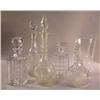Image 1 : A GROUP OF FIVE ASSORTED COLORLESS GLASS DECANTERS