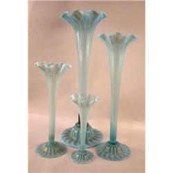 A SET OF FOUR BLUE OPALESCENT GRADUATED TALL VASES