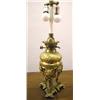 Image 1 : A ROCOCO STYLE KEROSENE ORMOLU MOUNTED TABLE LAMP