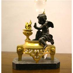 A LOUIS XVI STYLE ORMOLU CHENET MOUNTED AS A LAMP