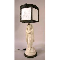 A BISQUE FIGURAL TABLE LAMP OF A YOUNG MAIDEN