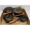 Image 1 : SET OF 4 CAST IRON POTS.