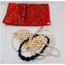 SILK BAG WITH NECKLACES