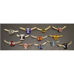 TWELVE ZUNI INDIAN BEADED BOLO SLIDES