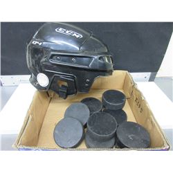 Hockey Helmet and Pucks / helmut is size 7 - 7 1/2 -   56 - 60cm