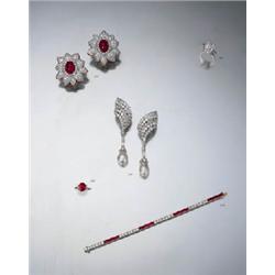  AN IMPRESSIVE PAIR OF RUBY AND DIAMOND-SET FLOWER-HEAD EARCLIPS