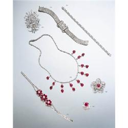 A RUBY AND DIAMOND-SET FLORAL BROOCH