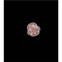 AN IMPORTANT FANCY PINK-ORANGE DIAMOND RING