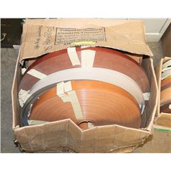 BOX OF PLASTIC EDGING FOR FURNITURE.