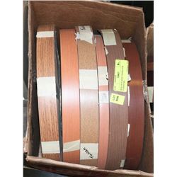 BOX OF PLASTIC EDGING FOR FURNITURE.