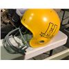 Image 10 : Table of various sports equipment, baseball bats, gloves, Hilltops Football helmet, antique hockey s