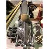 Image 19 : Table of various sports equipment, baseball bats, gloves, Hilltops Football helmet, antique hockey s