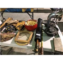 Table of various sports equipment, baseball bats, gloves, Hilltops Football helmet, antique hockey s