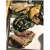 Image 5 : Table of various sports equipment, baseball bats, gloves, Hilltops Football helmet, antique hockey s