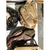 Image 7 : Table of various sports equipment, baseball bats, gloves, Hilltops Football helmet, antique hockey s