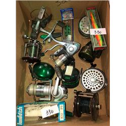 Box full of newer & older reels, fish hooks