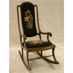 Bentwood rocker with floral needlepoint seat and back, 43"H