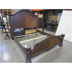 NEW ASHLEY KINGSIZE CARVED MAHOGANY PANEL BEDFRAME WITH PILLAR STYLE FOOTBOARD, RETAIL $3499, FLOOR 