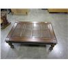 Image 2 : NEW ASHLEY DARK FINISH CARVED WITH GLASS TOP COFFEE TABLE, APPROX 4X5 FOOT, RETAIL $899