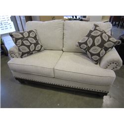 ASHLEY SIGNATURE CONTEMPORARY LOVESEAT WITH BRASS NAILHEAD AND THROW PILLOWS RETAIL $2499
