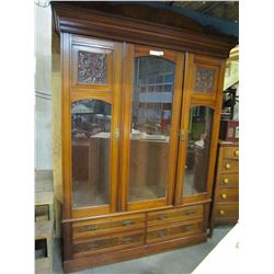 LATRGE ANTIQUE CARVED CABINET WITH 3 BEVELLED GLASS DOORS, AND 4 DRAWERS