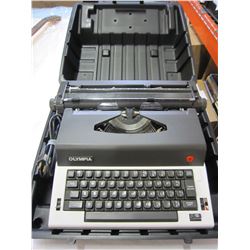 OLYMPIA BLACK AND WHITE TYPEWRITTER IN BLACK CASE