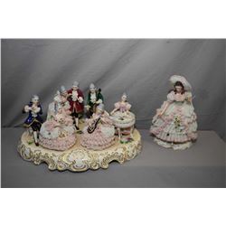 Two German Dresden figurines including seven figure musical scene 17" in length and a 10 1/2" lady, 