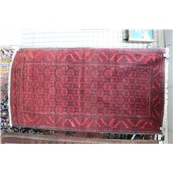 Persian wool carpet with red background, geometric center panel and border in black and cream, 39  X