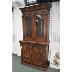 Antique carved European quarter cut oak court cabinet with multiple figural carvings including lions