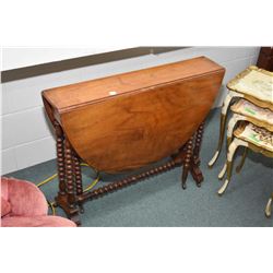 Antique gate leg table with bobbin supports and stretchers, fitted with original porcelain castors