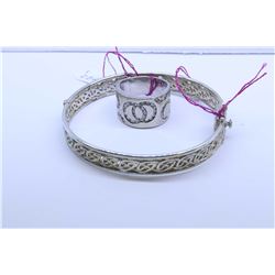 Hinged silver Celtic motif bracelet (no markings seen  and a sterling ring set with diamante style g