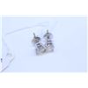 Image 1 : Pair of 14kt white gold and diamond stud earrings set with two .72ct brilliant white diamonds. Total