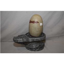 Hand carved fertility sculpture with soapstone base and rock egg, 12" in height