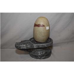 Hand carved fertility sculpture with soapstone base and rock egg, 12  in height