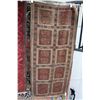 Image 1 : Persian wool carpet with copper colour background, geometric panels with highlights of blue, orange,