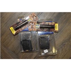 Four new in package Mossberg firearms accessories including two model 695 .12 ga magazines part no. 