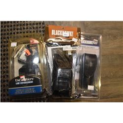 Three new in package firearm accessories including Black Hawk CQD weapon catch, Black Hawk stinger l