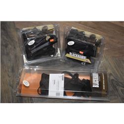 Three new in package Black Hawk left handed holsters including two for Glock 17/19/22/23/31/32 and a