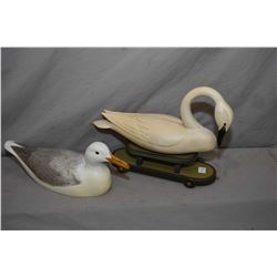 Hand carved and artist signed swan motif pull toy signed Reineri "92 and a hand carved "Glaucus wing